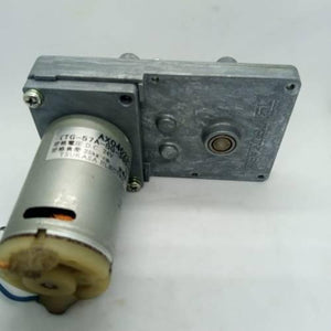 DC Worm Gear Motor AXO40231 - a silver cylindrical motor attached to a rectangular metal gearbox with a visible label showing specifications.