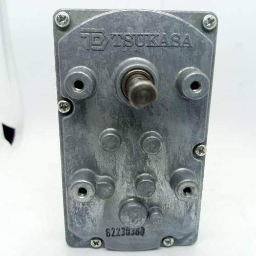 DC Worm Gear Motor AXO40231 - the grey metal casing with a central output shaft, mounting holes, and the Tsukasa brand name embossed on top.