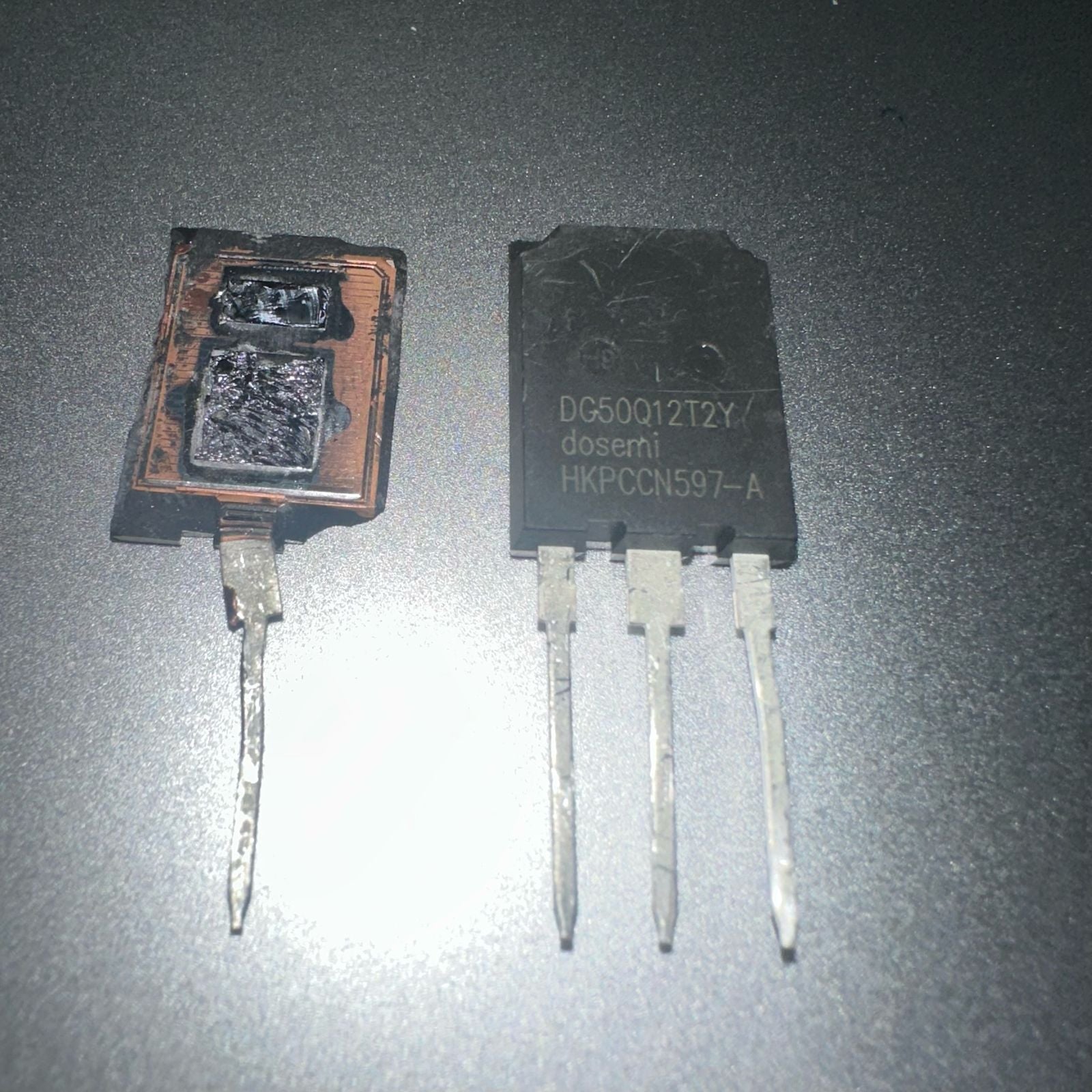 DG50Q12T2 50amp 1200V Dosemi | High-power IGBT Module | Digilog.pk - one intact black three-pin module next to a damaged, burnt-out version of the same component.