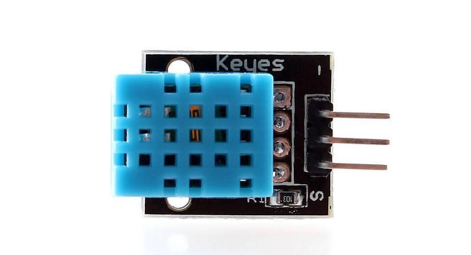DHT11 Temperature And Humidity Sensor Module Ky-015 - a blue sensor component mounted on a black PCB with three metal pins on the right side.