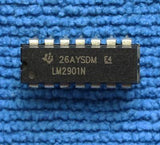 Differential Comparator IC LM2901N - a black 14-pin dual-in-line integrated circuit chip with white text markings, resting on a blue textured surface.