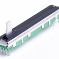 Digilog.pk - Slide Potentiometers B10K | Single Potentiometers & Variable Resistors Pakistan - linear variable resistor with a metal slider, green plastic base, and four metal pins on a white background.