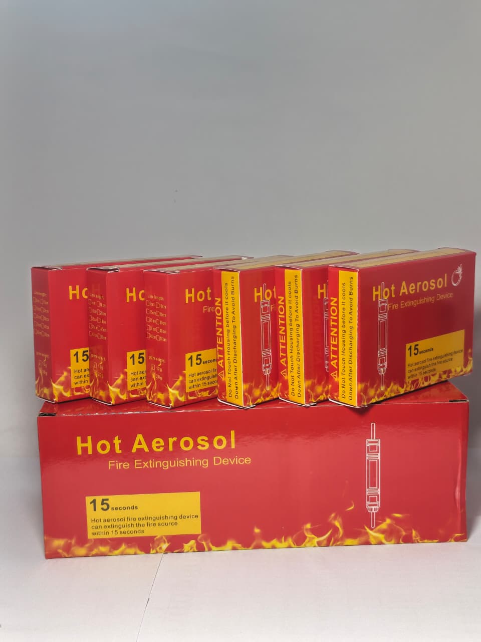 DIGILOG QRR0.01G Heat Aerosol Fire Extinguishing Device - six red boxes with fire graphics and text, arranged in a stack and a row.