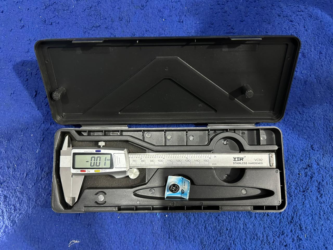 Digital Caliper 150mm - Yth VC92 Stainless Steel Vernier Caliper With LCD Display - black plastic storage case, showing the silver stainless steel tool with an LCD screen displaying -0.01 and a battery.