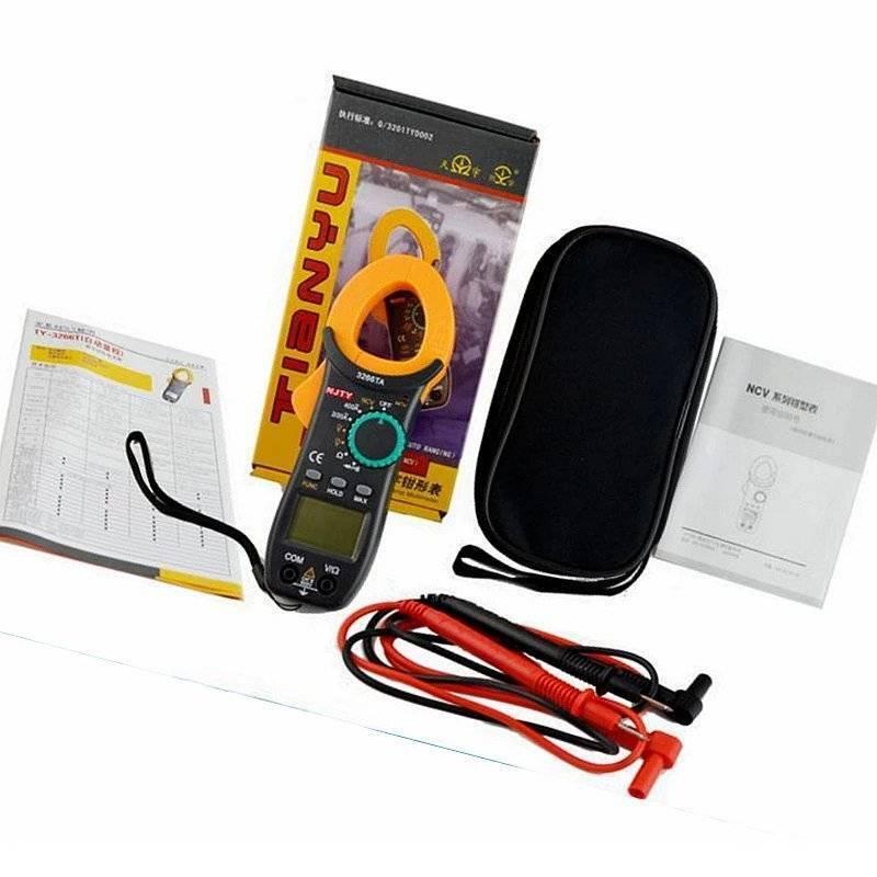 Digital Clamp Meter Njty DC/AC Volt AC Amp Diode NCV Multimeter AMMETER3266TA - shown with its box, black carrying case, two test leads, and two instruction manuals laid out on a white surface.