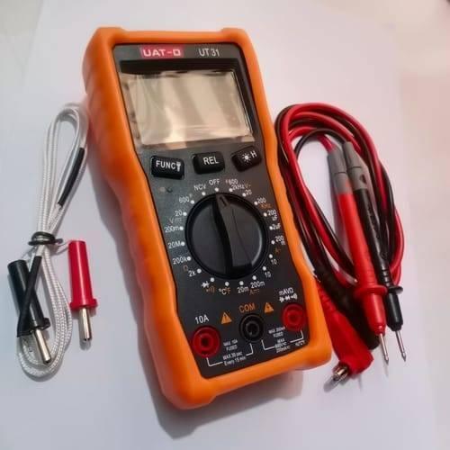 Digital Display Multimeter Ut 31 Non Contact Voltmeter Ammeter Ohm Temperature Test Meter DMM - an orange handheld unit with a central dial, buttons, ports, a blank screen, test leads, and a temperature probe.