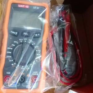 Digital Display Multimeter Ut 31 Non Contact Voltmeter Ammeter Ohm Temperature Test Meter DMM - an orange handheld device with a central knob, function buttons, and a port layout, packaged with red and black leads.