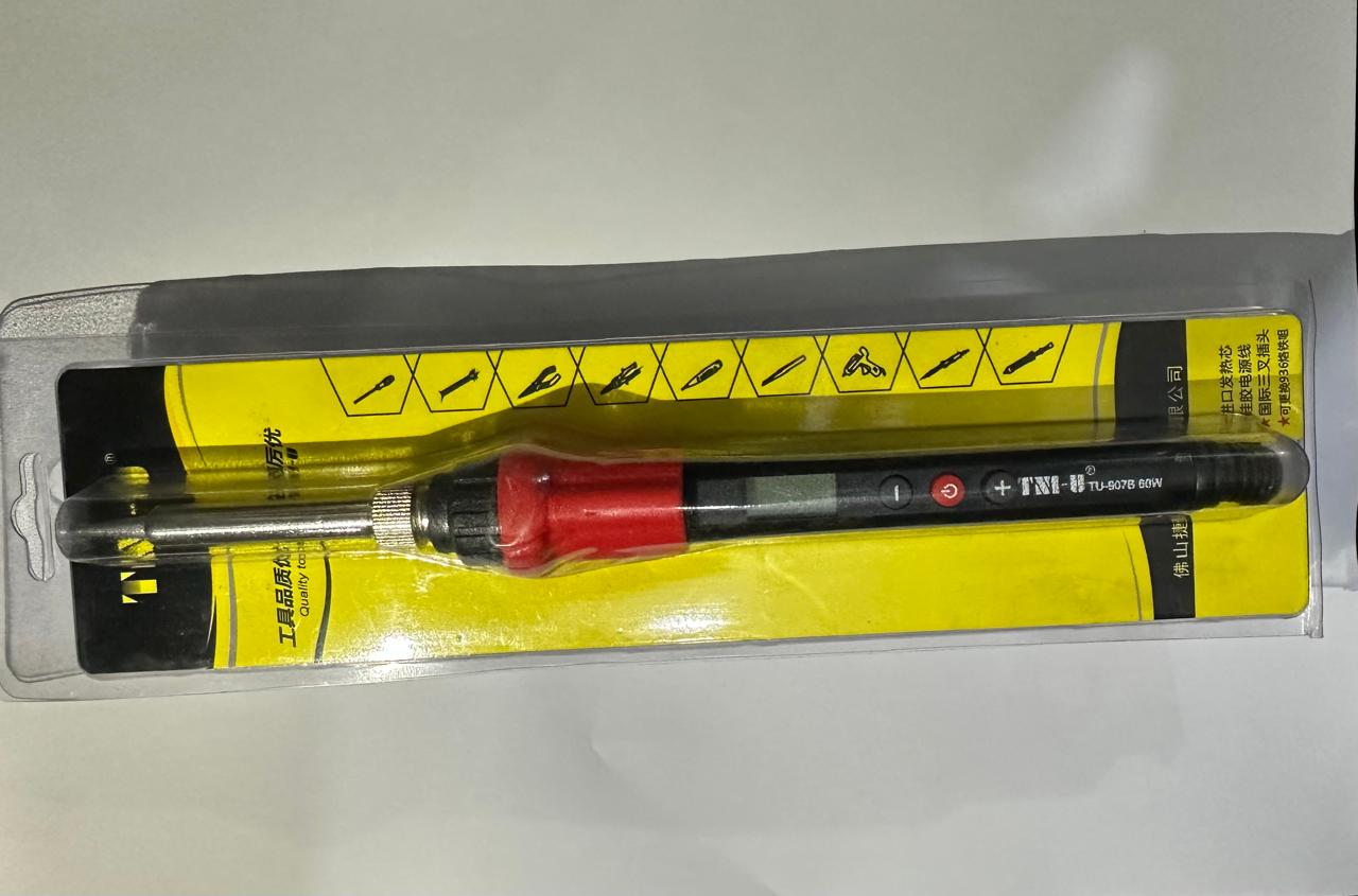Digital Electric Soldering Iron 60W - its original plastic blister packaging, featuring a black handle with a red grip, a digital display, and control buttons.