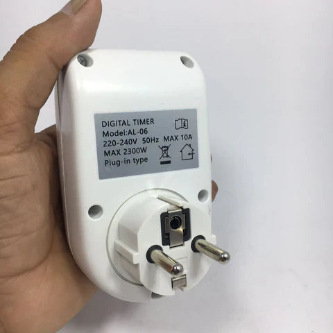 Digital Energy Saving Programmable Electronic Timer Plug - shown from the back, featuring a white plastic casing and a standard two-pin electrical plug.
