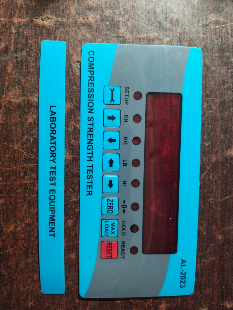 Digital hydraulic Pressure Gauge Metallic Body - shown as a blue rectangular control panel overlay with a digital display, buttons, and indicator lights.