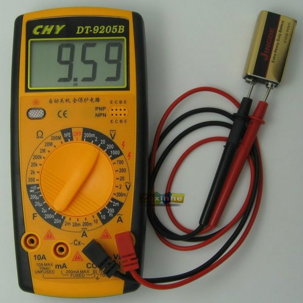 Digital Multimeter - DT-9205B - a yellow and black handheld device with a screen showing 9.59, a central rotary knob, and probes connected to a 9V battery.