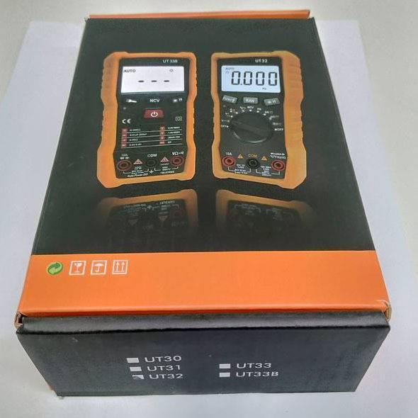 Digital Multimeter Uat-d Ut 32 - a black and orange box showing images of two different multimeter models on the front with a model list printed on the side.
