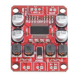 Digital Power Amplifier Board - Dual Channel 2x15w Stereo Amplifier With Reduced Distortion - rectangular circuit board featuring four capacitors, four inductors, a central chip, and labeled power and audio ports.