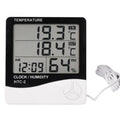 Digital Thermometer And Hygrometer Htc-2 - a black and white device with a digital display reading 19.3°C IN, 18.4°C OUT, 12:09 AM, and 64% RH.
