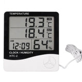 Digital Thermometer And Hygrometer Htc-2 - a black and white device with a digital display reading 19.3°C IN, 18.4°C OUT, 12:09 AM, and 64% RH.
