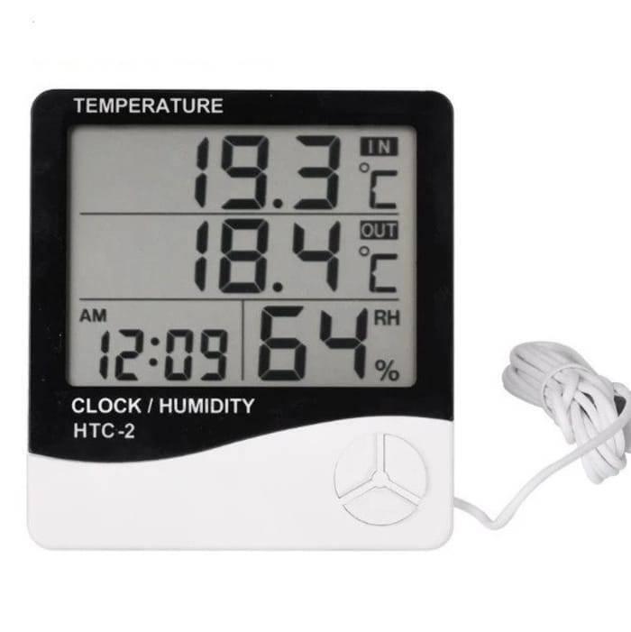 Digital Thermometer And Hygrometer Htc-2 - a black and white device with a digital display reading 19.3°C IN, 18.4°C OUT, 12:09 AM, and 64% RH.