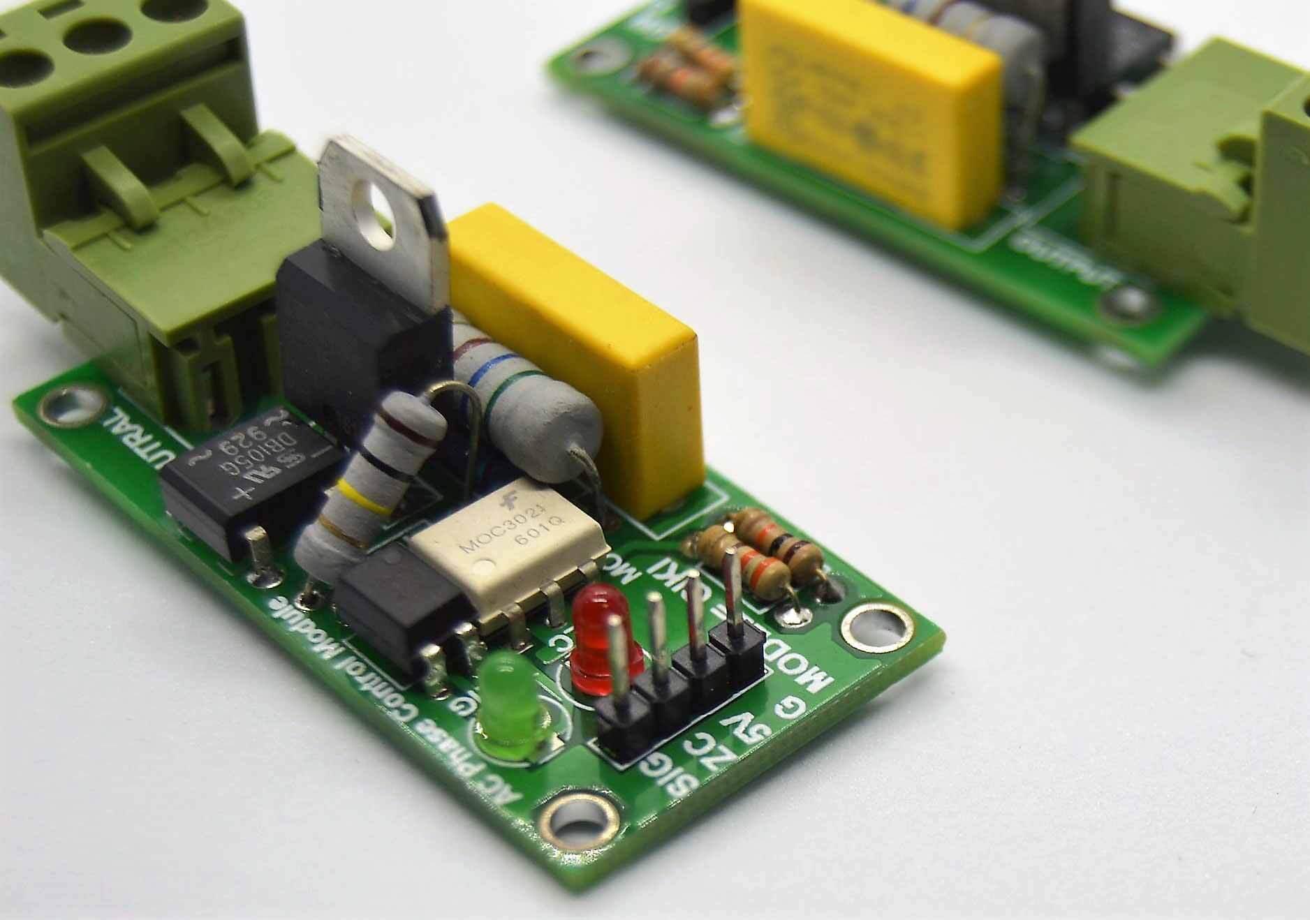 Discontinued 2amp 220V AC Arduino 1 Channel TRIAC Module With Zero Crossing Sensor - shown as two green circuit boards with terminals, LEDs, and pins.