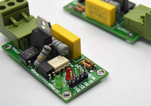 Discontinued 2amp 220V AC Arduino 1 Channel TRIAC Module With Zero Crossing Sensor - shown as two green circuit boards with terminals, LEDs, and pins.