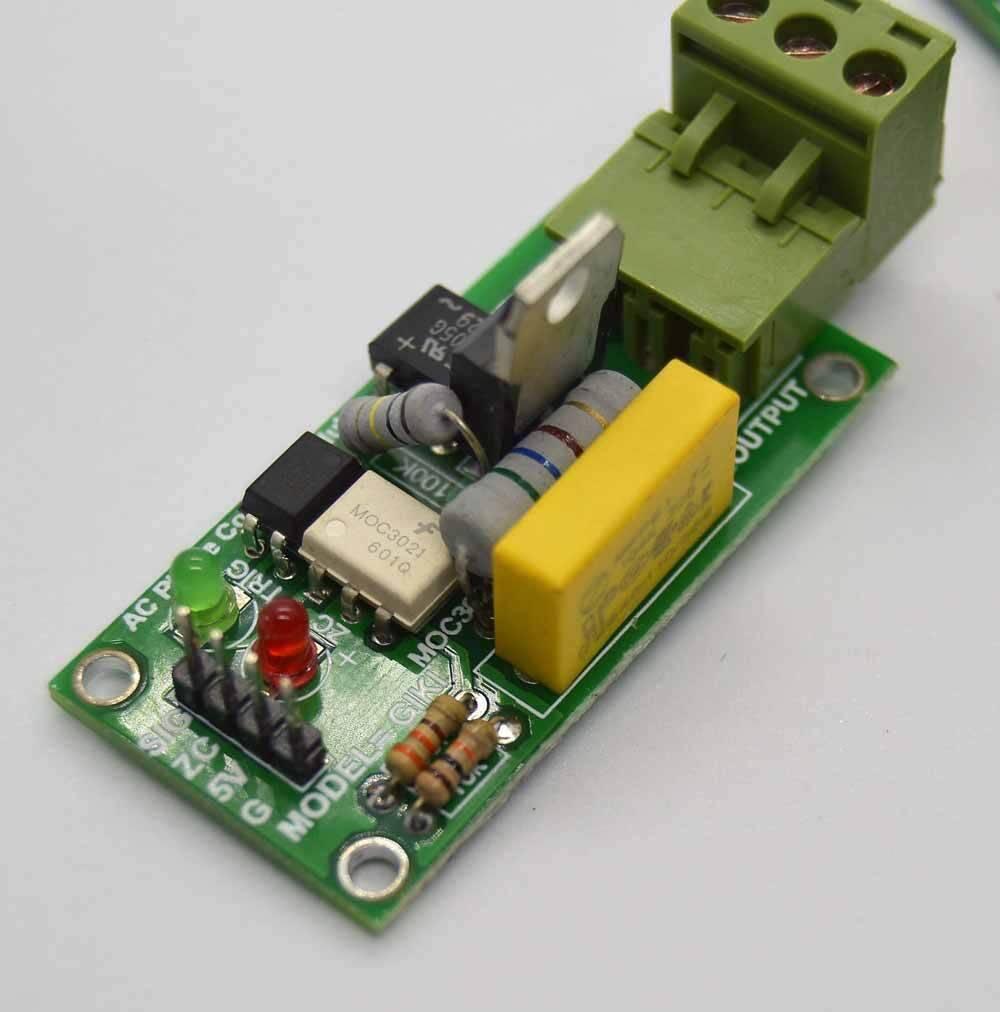 Discontinued 2amp 220V AC Arduino 1 Channel TRIAC Module With Zero Crossing Sensor - a green PCB with a terminal block, MOC3021 IC, and LED.