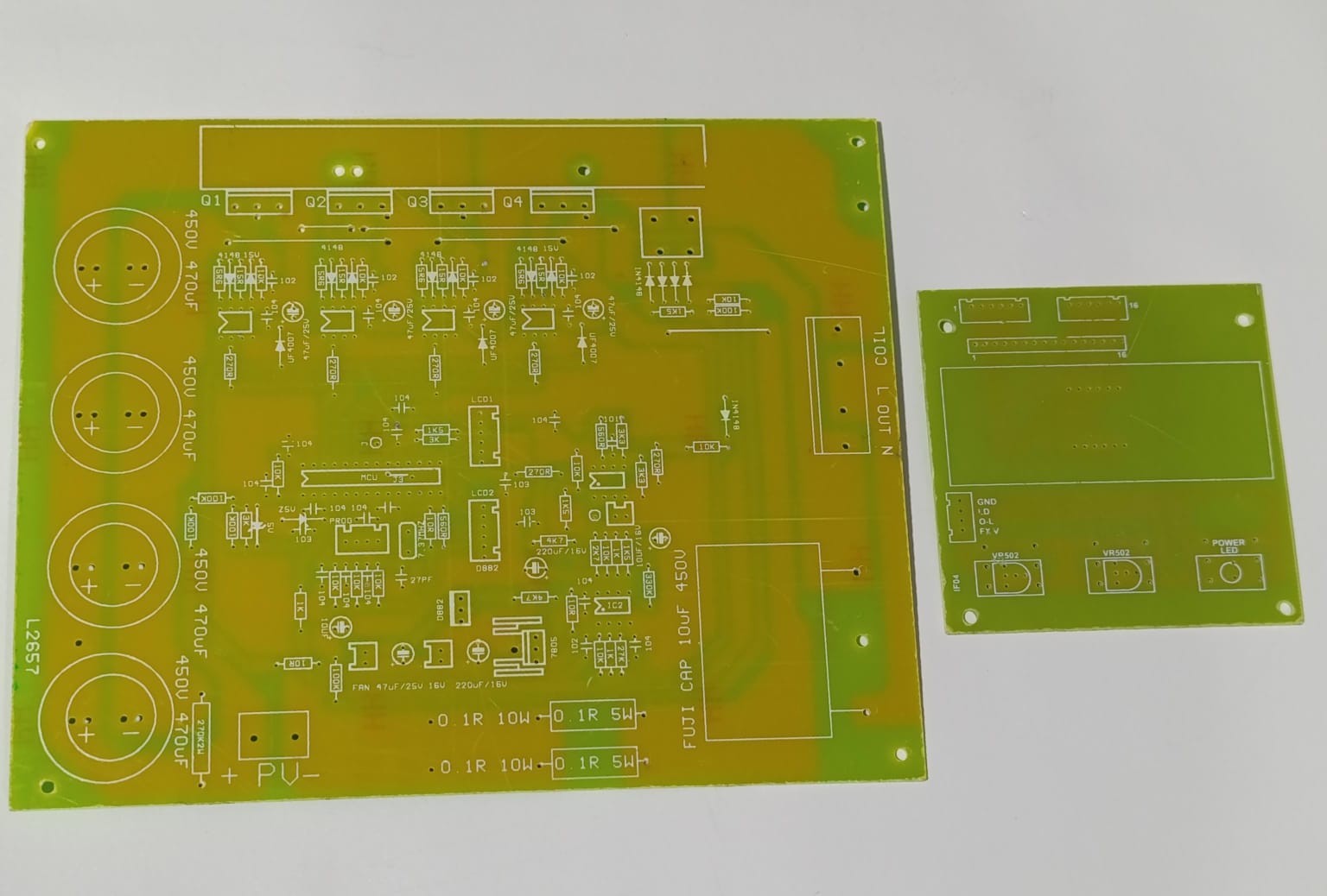 Discontinued Local 4 IGBT Solar Inverter PCB Board - a large green main circuit board and a smaller rectangular green control board.