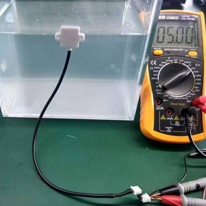 Discontinued Mini 5V Liquid Water Level Sensor Detection Switch With Alarm XKC-Y23-V - connected to a yellow digital multimeter displaying 05.00.