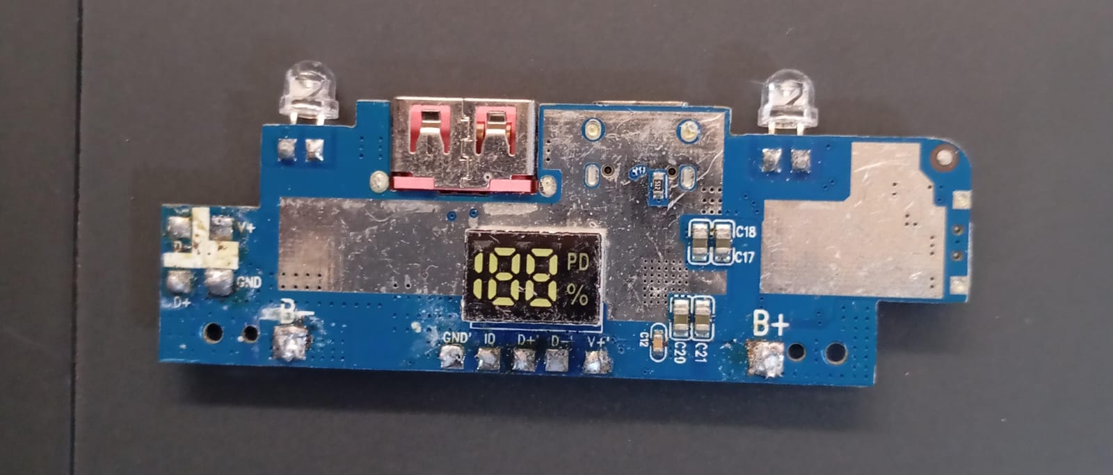 Power Bank Charging Module Board – CSZR-2107A-5356 (4.35V) ( stock LOT ) - a blue rectangular circuit board featuring a digital display showing 188 PD%, two LEDs, and USB ports.