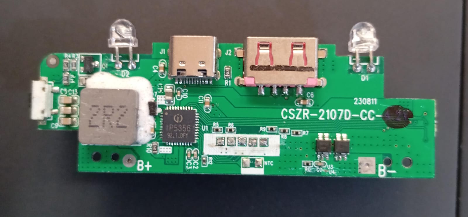 Power Bank Charging Module Board – CSZR-2107A-5356 (4.35V) ( stock LOT ) - a green rectangular circuit board with a USB-C port, USB-A port, micro-USB port, and two LEDs.