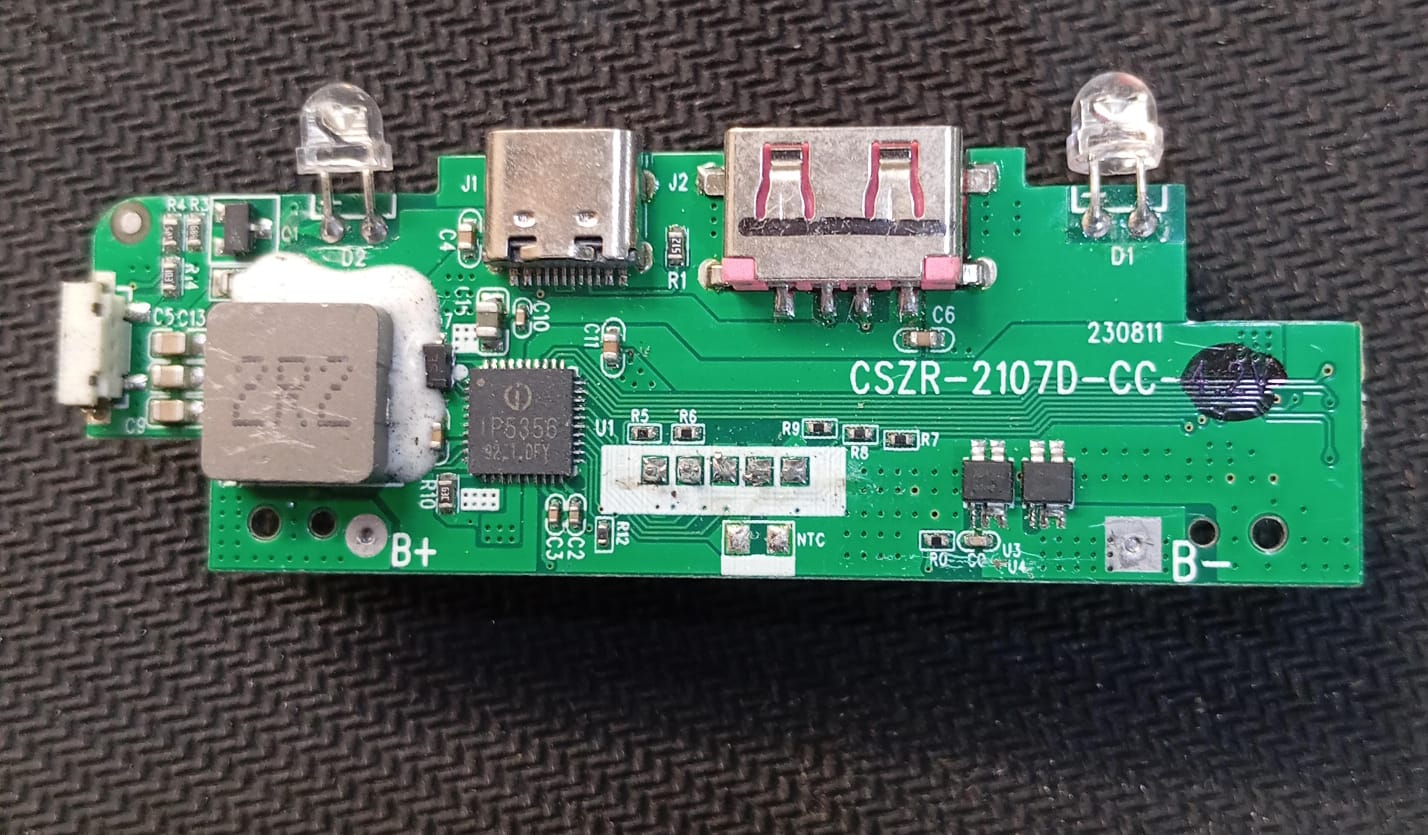 Power Bank Charging Module Board – CSZR-2107A-5356 (4.35V) ( stock LOT ) - a green rectangular circuit board with a USB-C port, USB-A port, two LEDs, and an inductor.