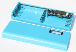 Solderless LCD Display Dual USB DIY Power Bank Module - shown as a disassembled light blue plastic case with internal battery springs and circuit board.
