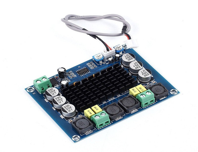 Discontinued XH-M543 TPA3116D2 Dual-channel Class D Digital Audio Power Amplifier Board 50W*2 - a blue rectangular circuit board with a black heatsink, several capacitors, green screw terminals, and a wired connector.