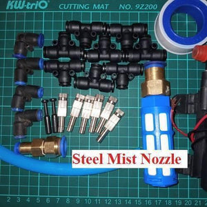 Disinfection Gate Misting System Accessory With Brass Nozzle - shown as a flat-lay of black plastic connectors, metal misting nozzles, and a blue filter.