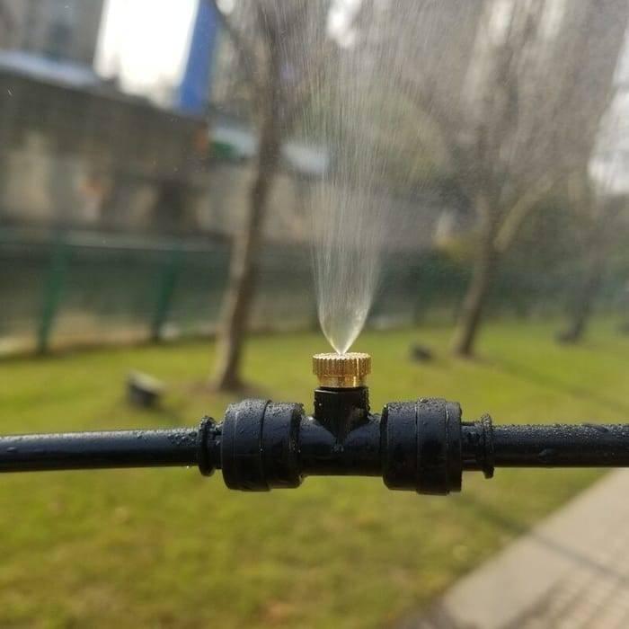 Disinfection Mist Making Nozzle And t Base Fogging Sanitization - a brass nozzle attached to a black plastic T-connector spraying a fine mist.