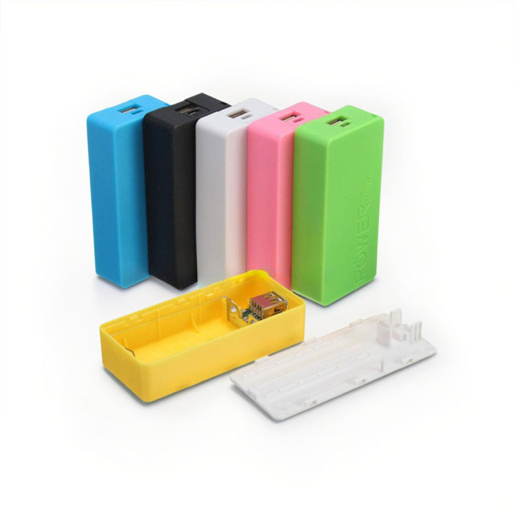 DIY 18650 Power Bank Case 2xCell - shown as five assembled units in blue, black, white, pink, and green, with one yellow disassembled case and a white lid.