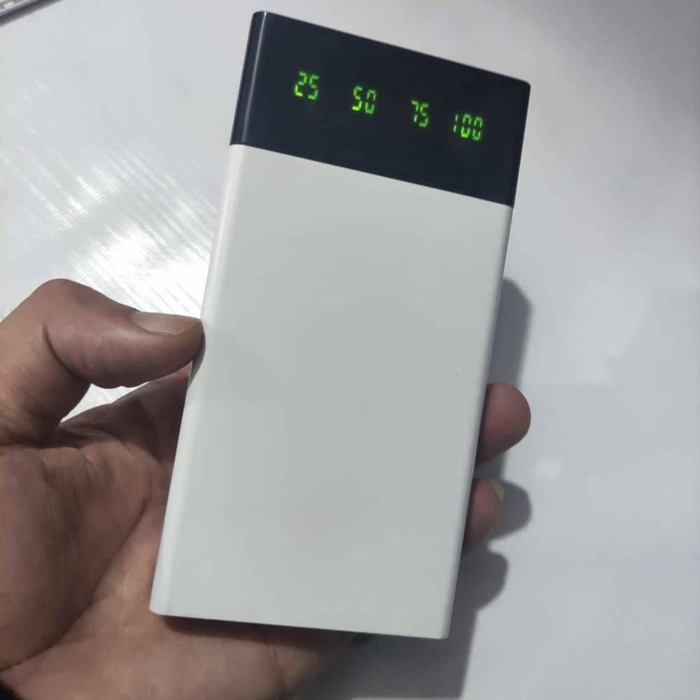 DIY 5V 2A Dual USB Power Bank Case With Power Bank Kit - shown as a white rectangular casing held in a hand with a digital display showing 25, 50, 75, 100.