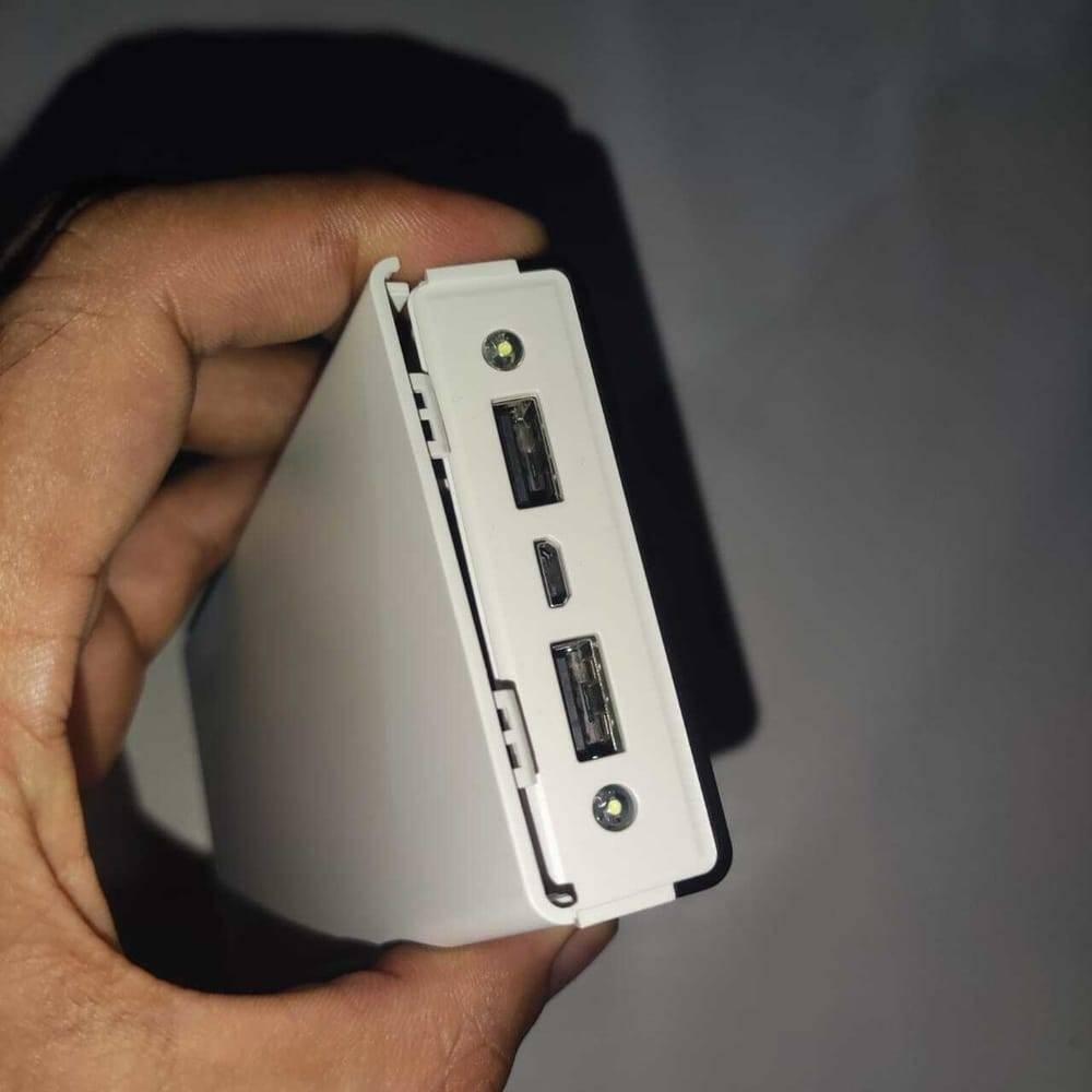DIY 5V 2A Dual USB Power Bank Case With Power Bank Kit - a close-up of the white plastic housing with two USB ports, a micro-USB port, and an LED.