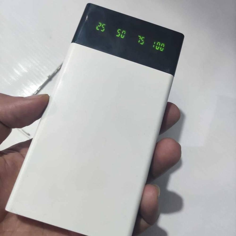 DIY 5V 2A Dual USB Power Bank Case With Power Bank Kit - a white rectangular power bank housing with a black top panel featuring a digital display indicating 25, 50, 75, 100.