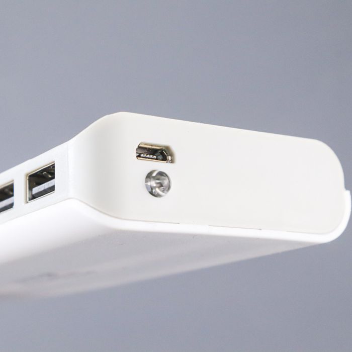 DIY 5x18650 Power Bank Case Dual USB Power Bank Box Shell Dual USB Charging Box With Digital Display Screen(without Battery) - a close-up of the white plastic housing showing two USB output ports, a micro-USB input port, and a circular LED light.