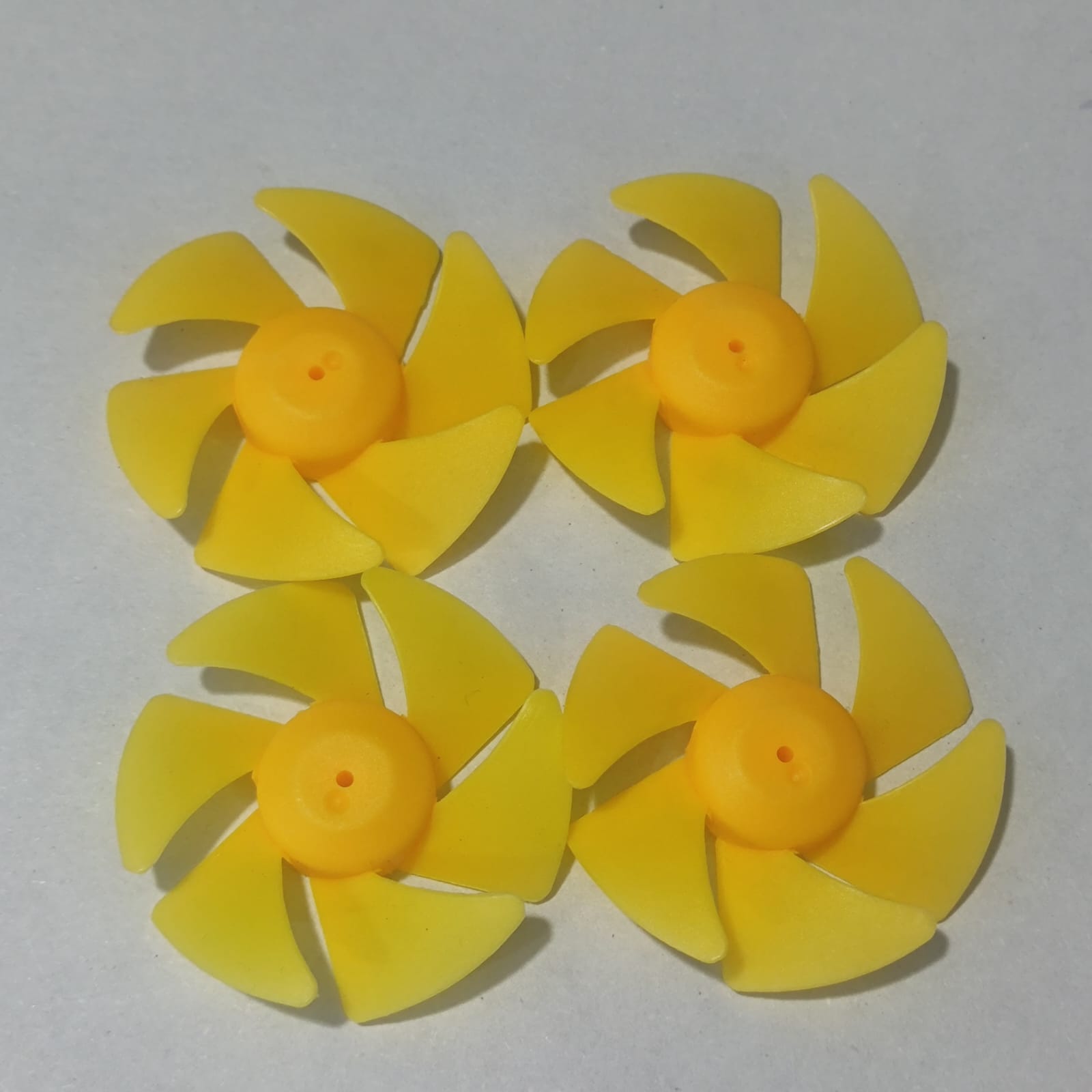 DIY Boat Model 6-blades Propeller 2mm Vortex Fan Paddle Toy Car Fan Spare Part 2*50mm - four identical yellow plastic six-bladed propellers arranged in a square on a white background.