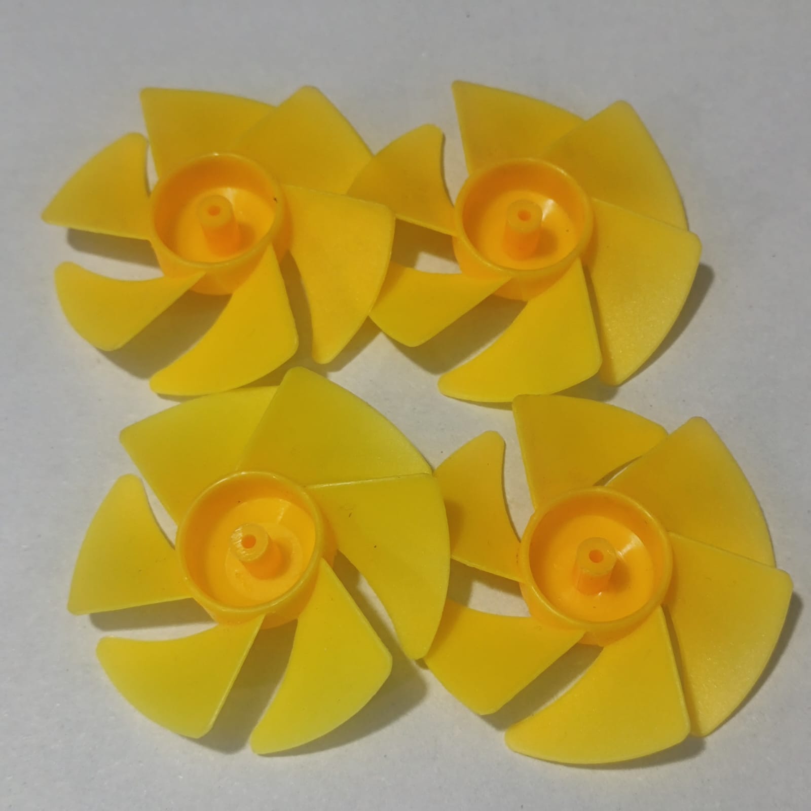 DIY Boat Model 6-blades Propeller 2mm Vortex Fan Paddle Toy Car Fan Spare Part 2*50mm - four identical yellow plastic six-bladed propellers arranged in a square on a white background.