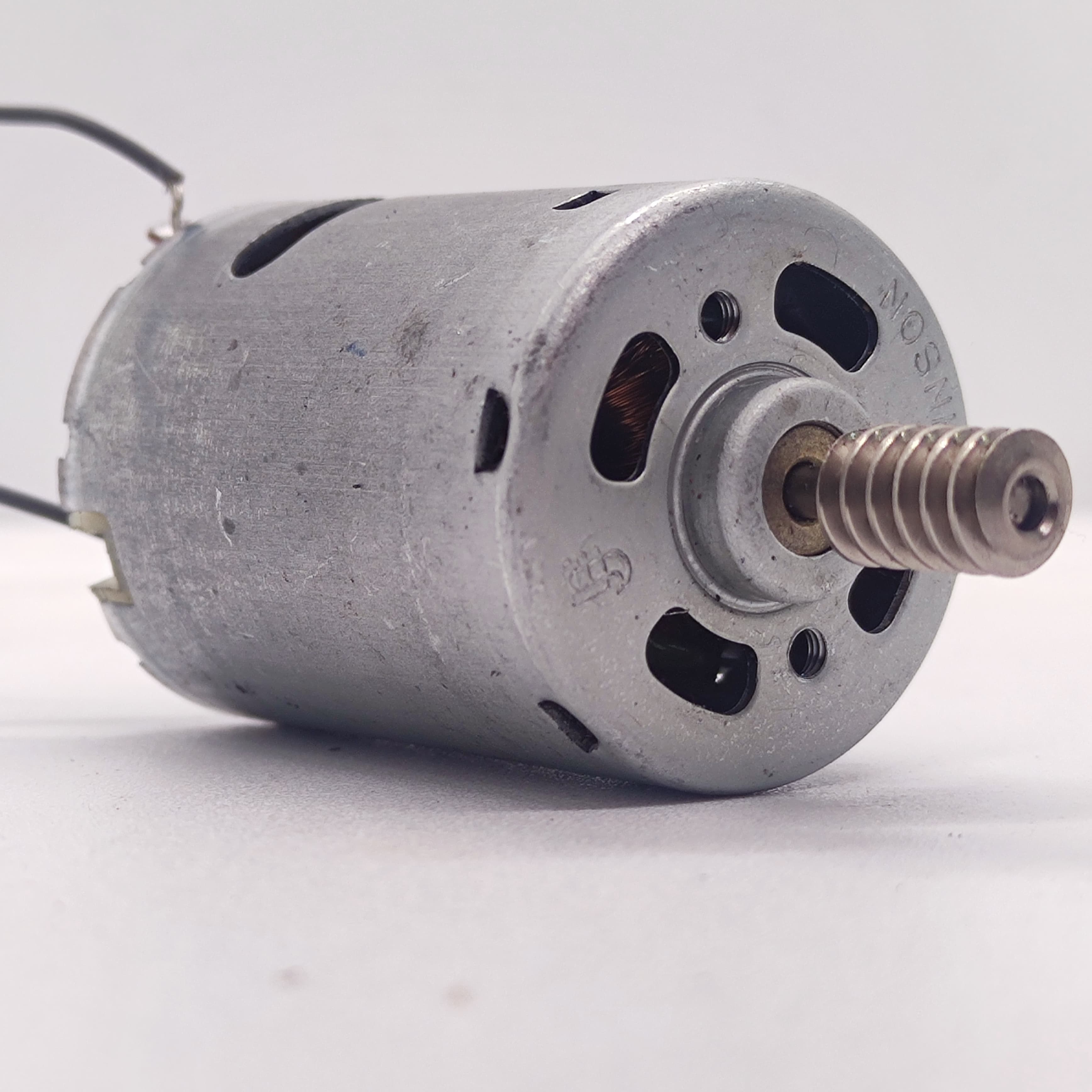 DIY DC Motor DC 3V To 25V Torque Mini Motor 17500RPM - a silver cylindrical DC motor with a threaded metal shaft and two black wires attached.