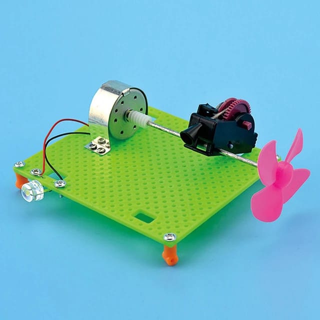 DIY Electric Circuit Kit Unassembled Developmental Toy Collectibles - a green perforated base with a motor, a pink propeller, and an LED.
