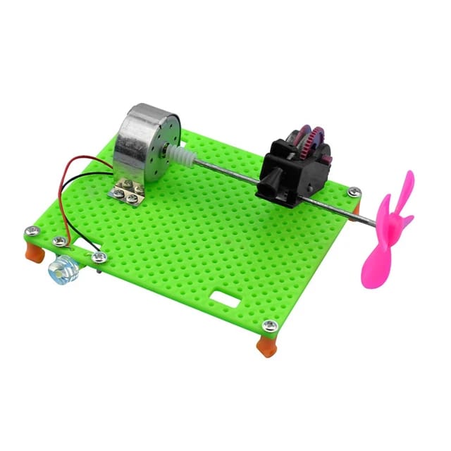 DIY Electric Circuit Kit Unassembled Developmental Toy Collectibles - a green perforated base plate with a motor, propeller, LED, and gear assembly.