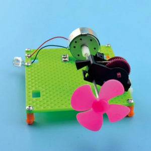 DIY Electric Circuit Kit Unassembled Developmental Toy Collectibles - a green base plate with an LED, a small motor, and a pink four-blade fan.