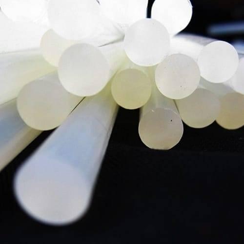 DIY Hot Melt 7mm Glue Stick - a close-up showing a bundle of translucent, cylindrical adhesive sticks arranged together against a dark background.