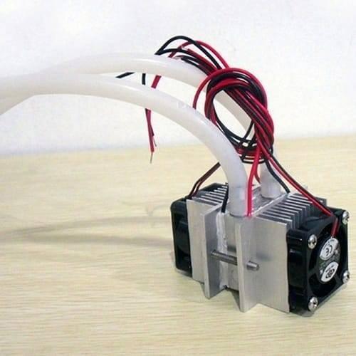 DIY Kits Thermoelectric Peltier Refrigeration Cooling System Water Cooling+ Fan+ 2pcs TEC1-12706 Coolers - a silver metal heatsink assembly with two black cooling fans and white tubing.
