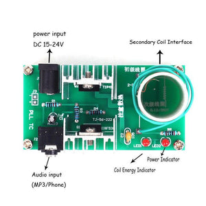 DIY Mini Tesla Coil Plasma Speaker Kit Unassembled - a green circuit board with a power jack, audio input port, two heatsinks, two LEDs, and a copper wire coil.