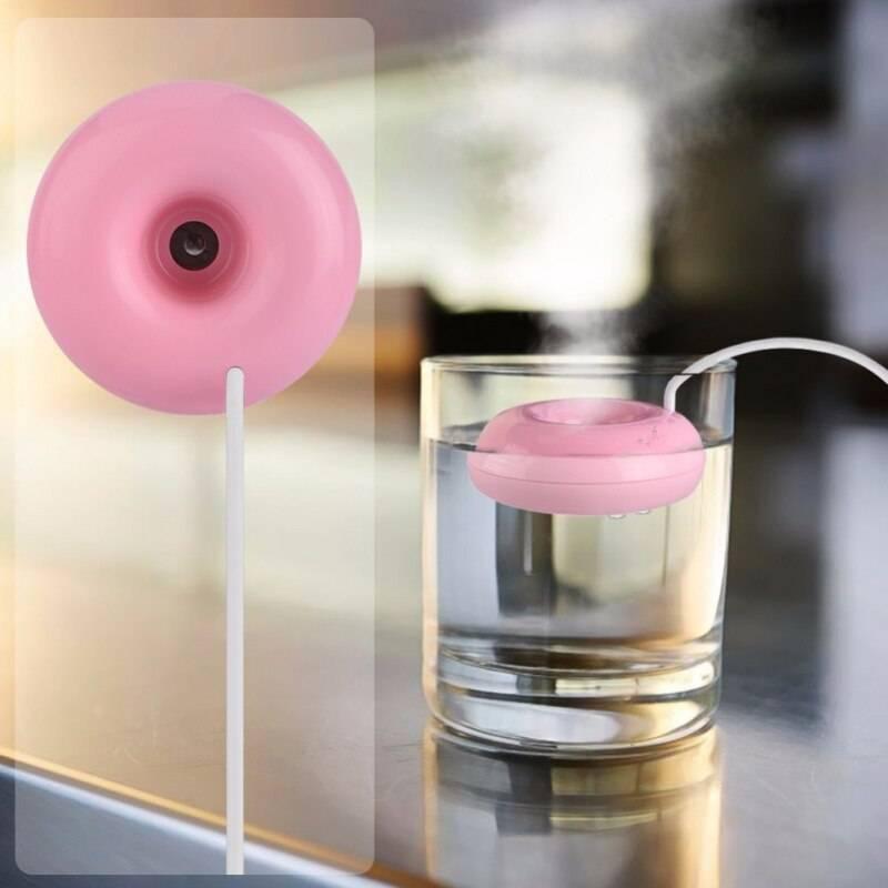 Donuts Shape Mini USB Humidifier Mist Maker Air Diffuser - shown as a pink, donut-shaped device floating in a glass of water with a white USB cable.