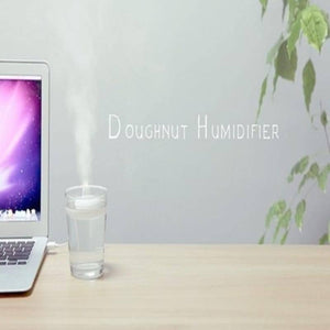 Donuts Shape Mini USB Humidifier Mist Maker Air Diffuser - connected by a white USB cable to a laptop.