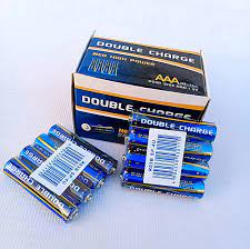 Double Charge Heavy Duty Cells AAA Size 1.5V Battery Cell For All Type Of Remotes 1 Pcs - shown as a cardboard box and two small packs of blue and yellow batteries with barcodes on white labels.