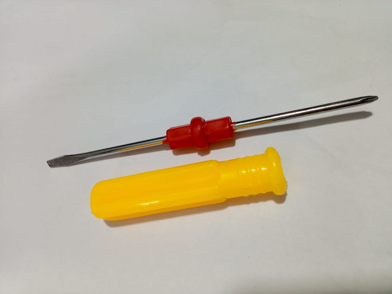 Double Head Plastic Handle Screwdriver - shown as a metal shaft with a red center grip and a separate yellow plastic handle.